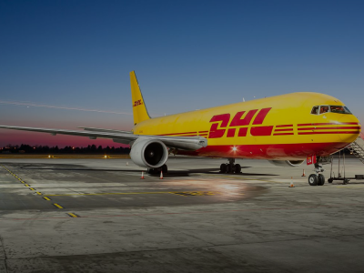 Cargo Plane with DHL branding parked on an airport landing strip