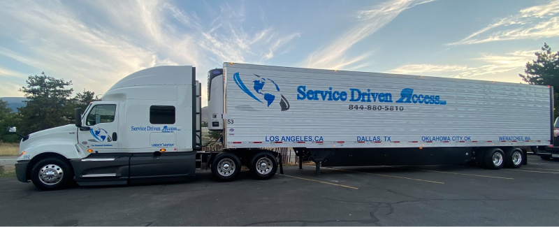 Service Driven Transport Semi Truck with Service Driven Access logo on the trailer and cab